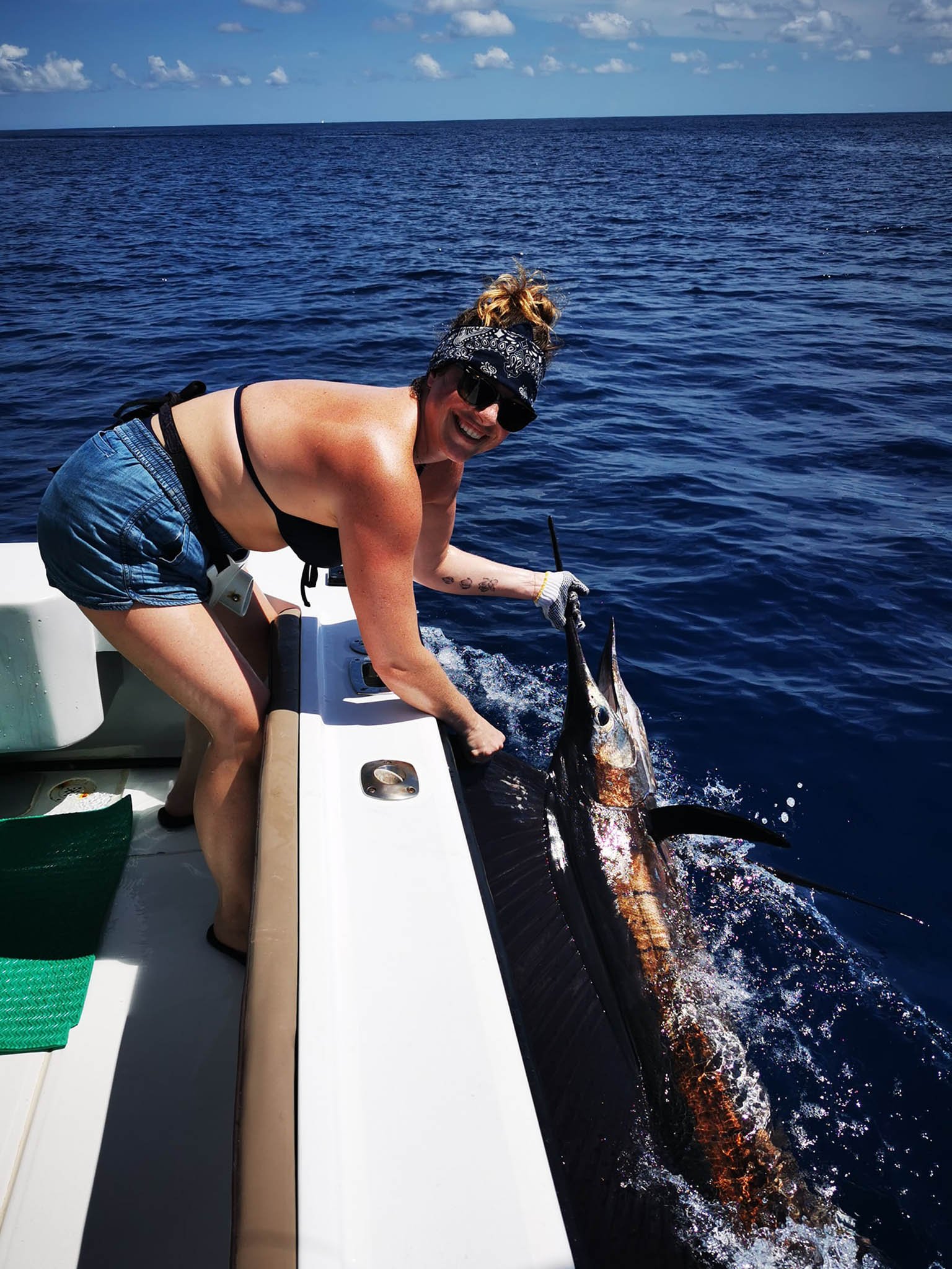 Group of women celebrating a sailfish catch on a Costa Rica charter
